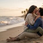 Couple on beach - 8 Things That Sound Hot Until You Actually Do Them Blog Post